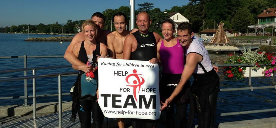 Team help for hope posing with the help for hope banner